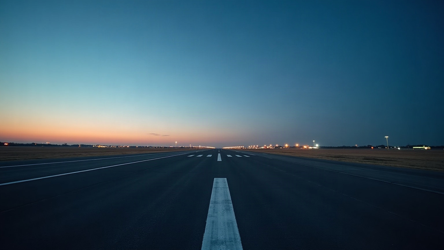 An empty runway at dusk